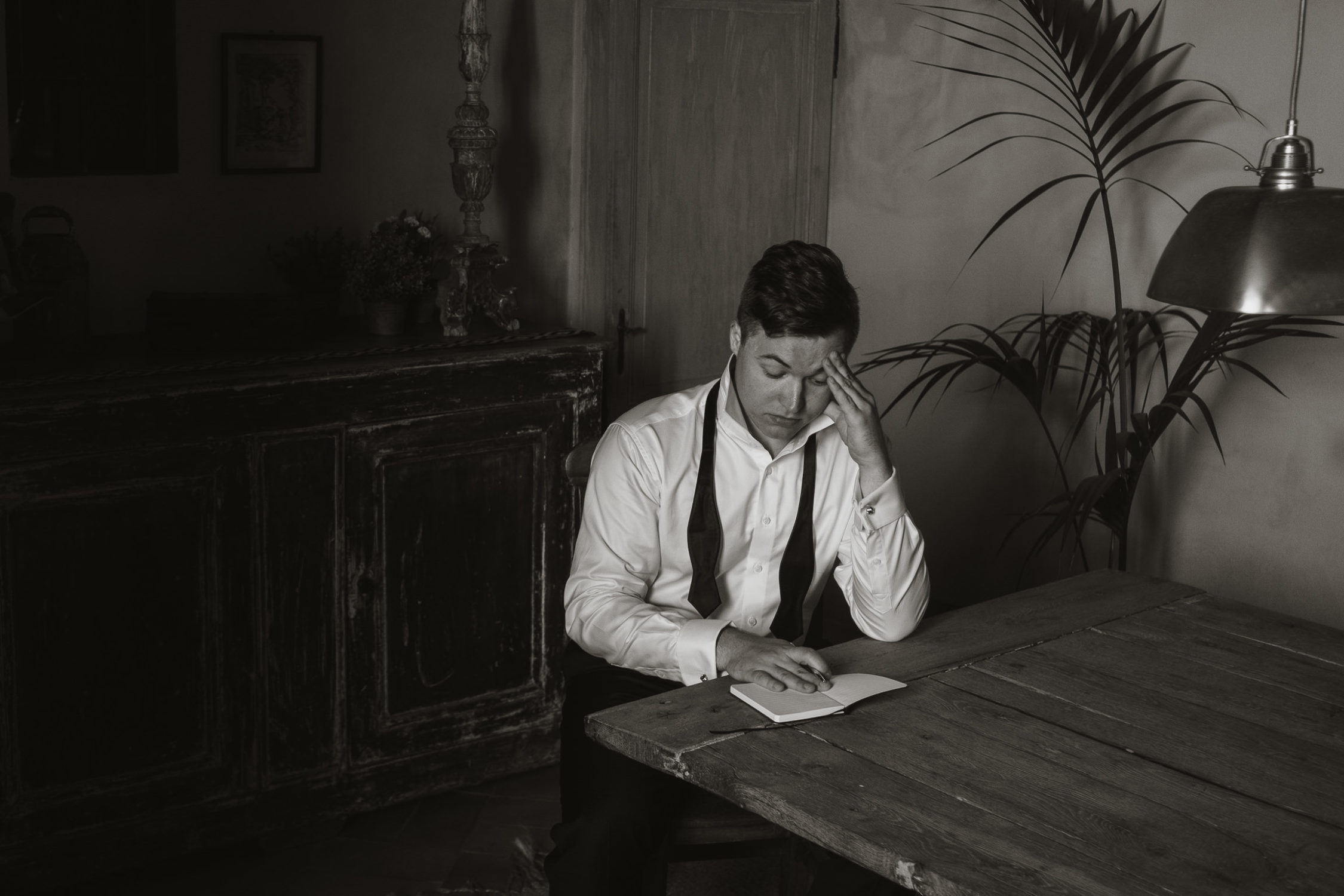 groom writing vows elopement